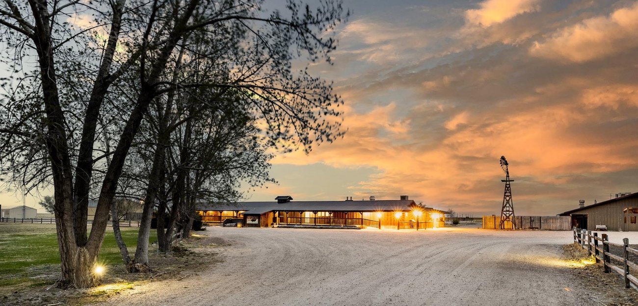 lodge-building-with-windmill-at-sunset-colorado-bow-barrel-lodge-colorado-bow-barrel-lodge