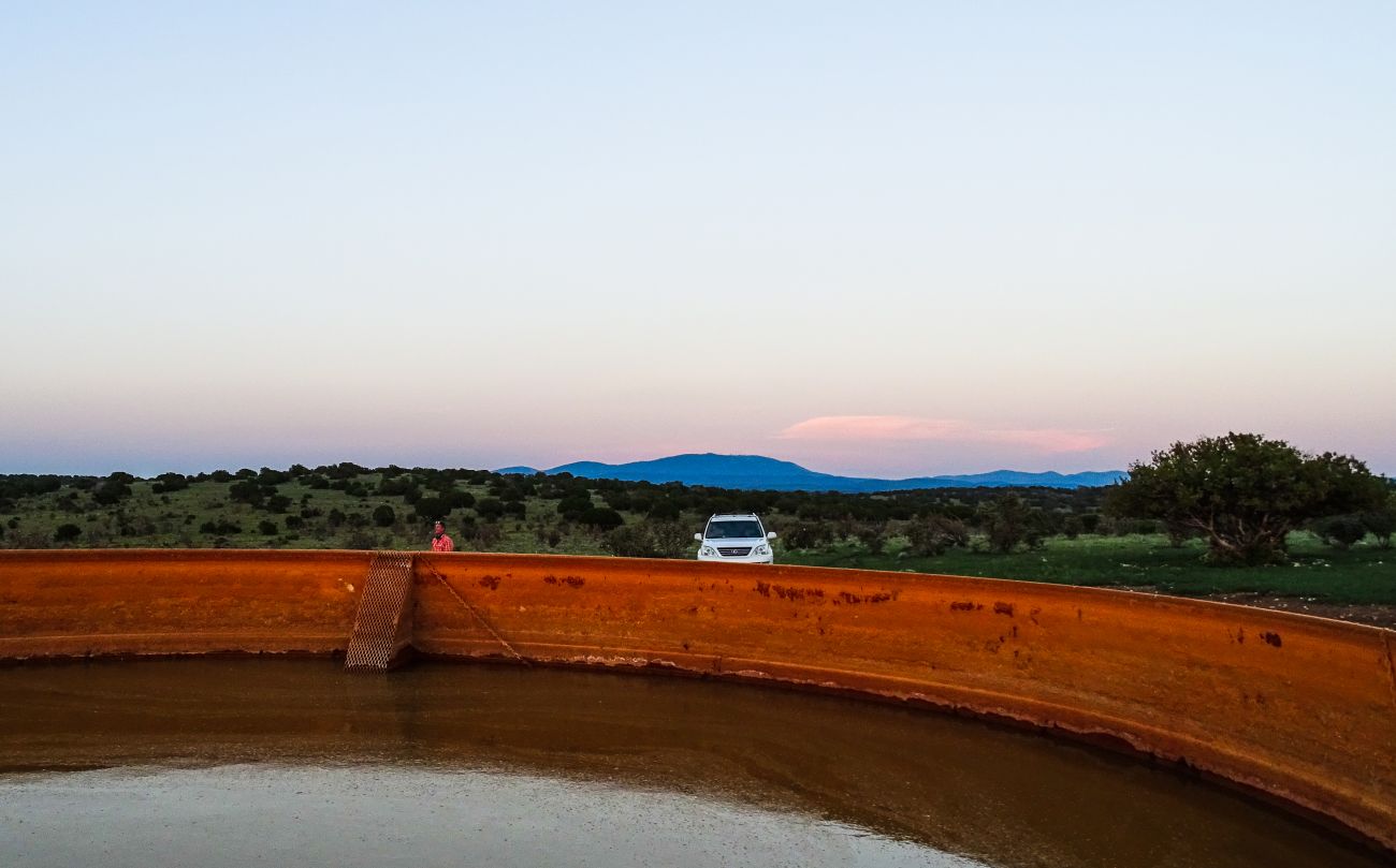 Watertank-red-sunset-mountain-new-mexico-The-Eason-Ranch
