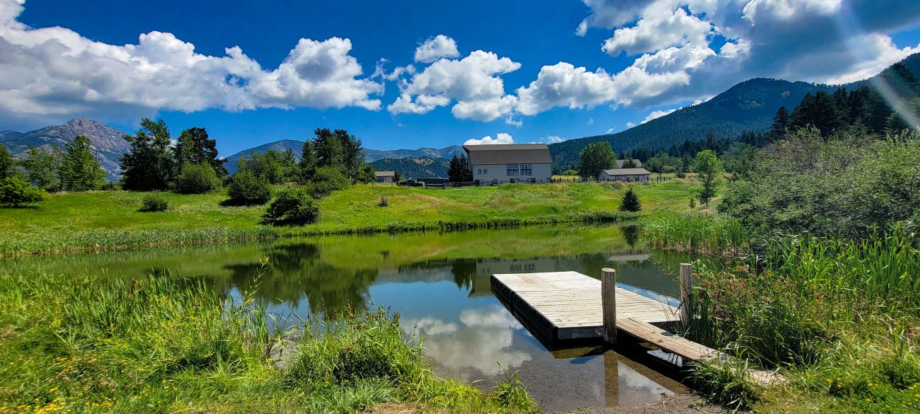 dock-pond-mountains-montana-windcall-ranch